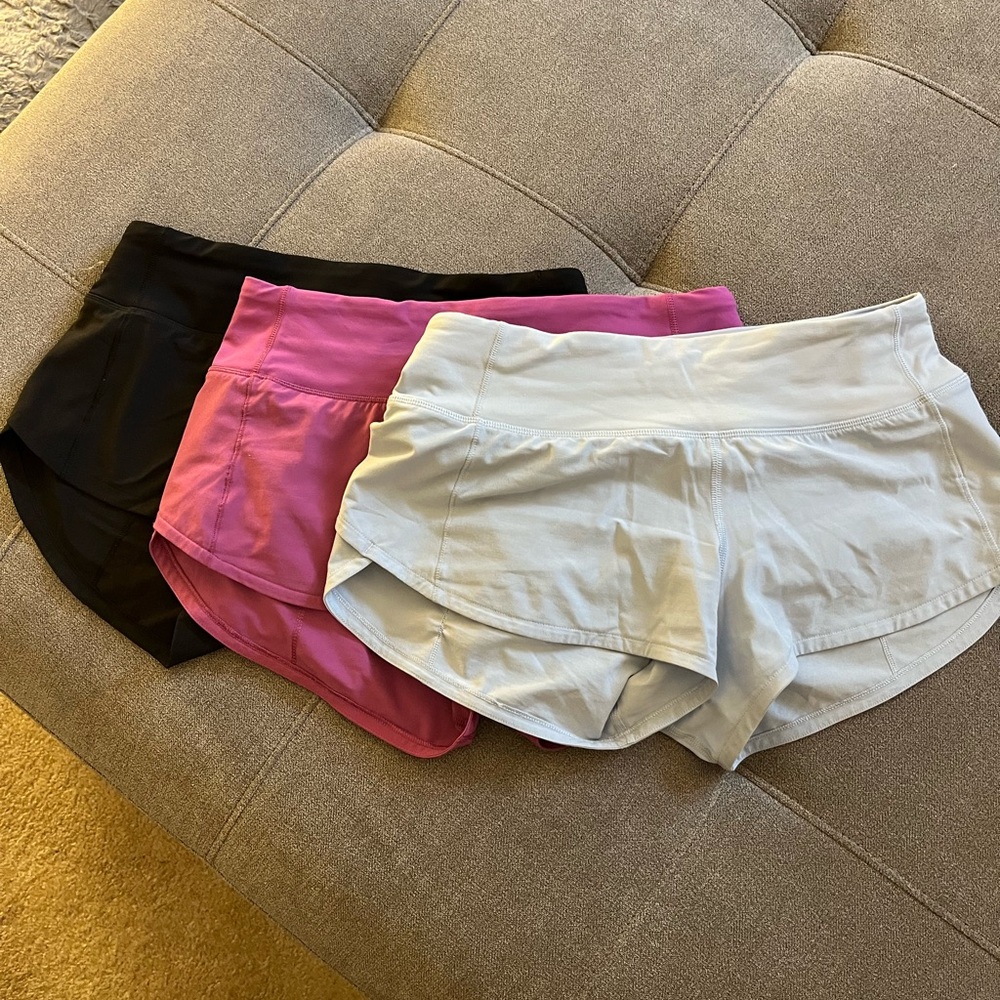 Lululemon speed up low rise shorts.  Black, purple and light blue.